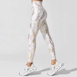 White with gold shimmer leggings. Size Small. Never worn. Perfect for brides!
